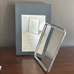 New in box Georg Jensen Polished Silver tableau mirror. Makes a beautiful gift
